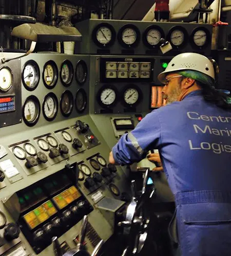 Central Marine Logistics employee at controls