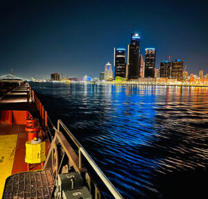 City lights glowing on water - view from a a freighter